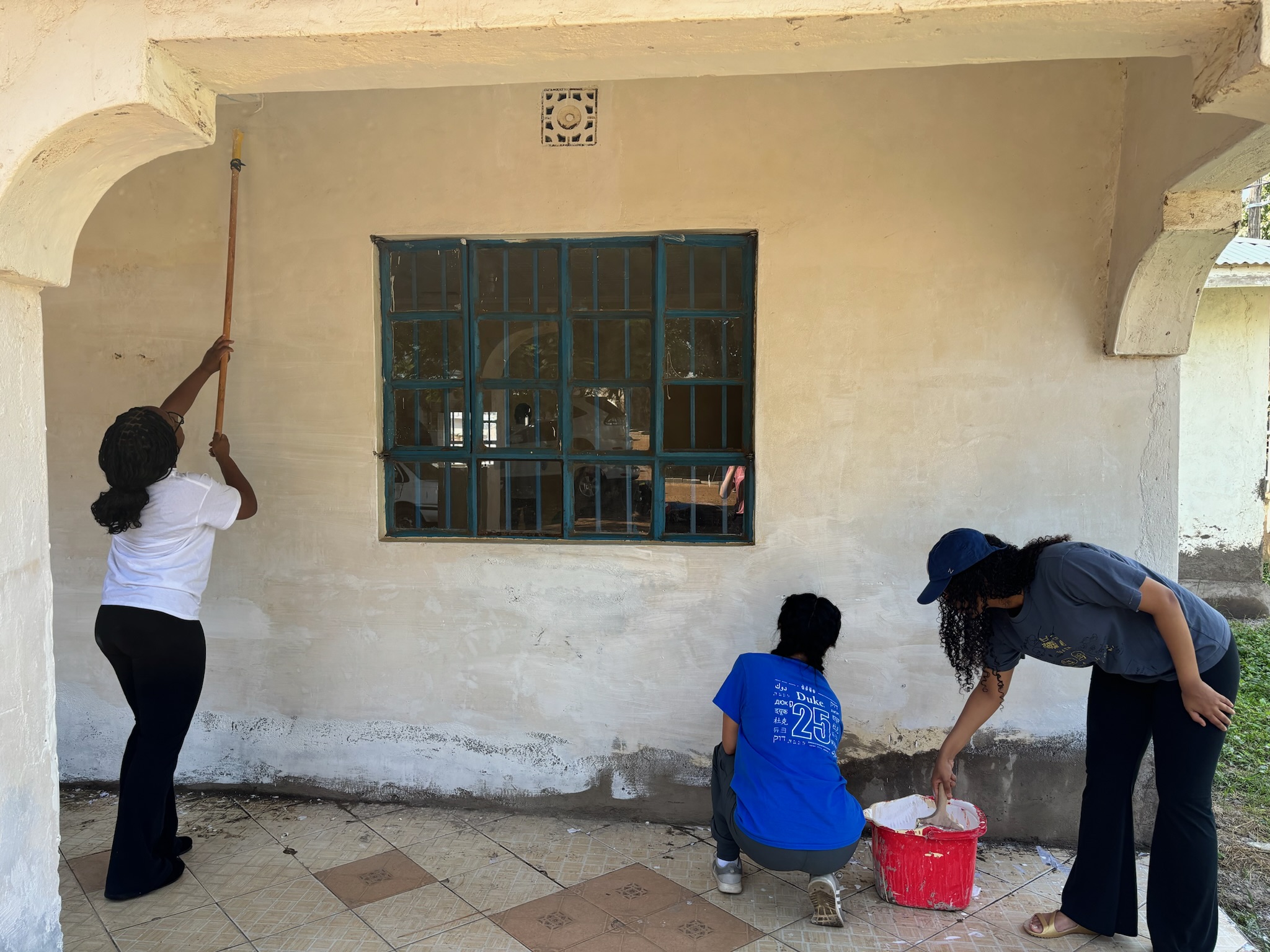 Team working together on exterior renovation